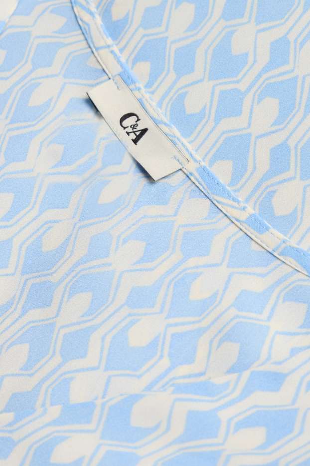 Dona - Brusa amb el coll en punta - estampada - blanc / blau clar