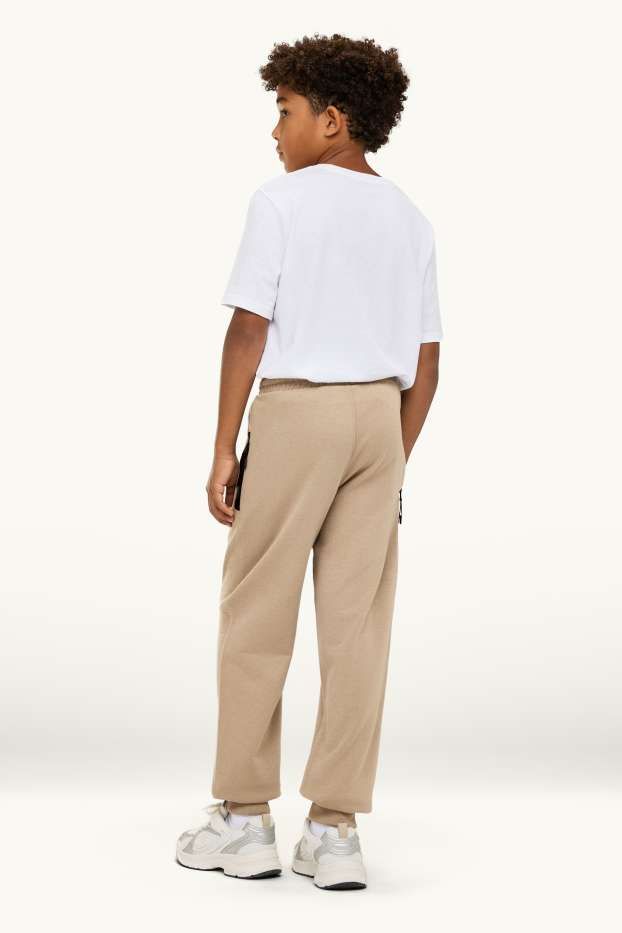 Kinder Buben - Jogginghose - schwarz / beige