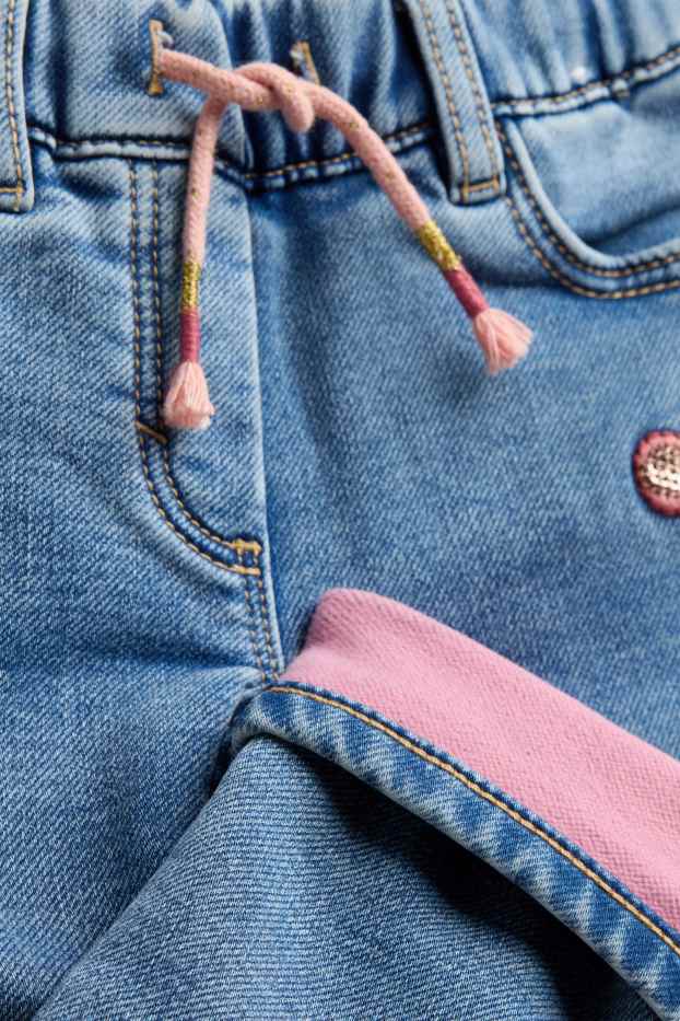 Kinderen: meisjes - Vlinder - jegging jeans - thermojegging - glanseffect - jeanslichtblauw