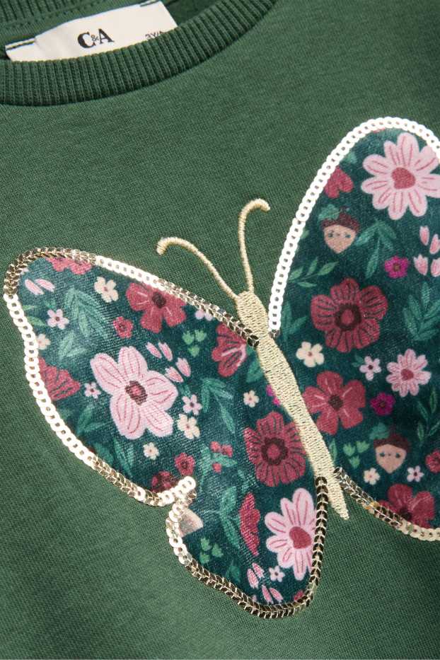 Nena - Papallona i flors - dessuadora - efecte brillant - verd fosc