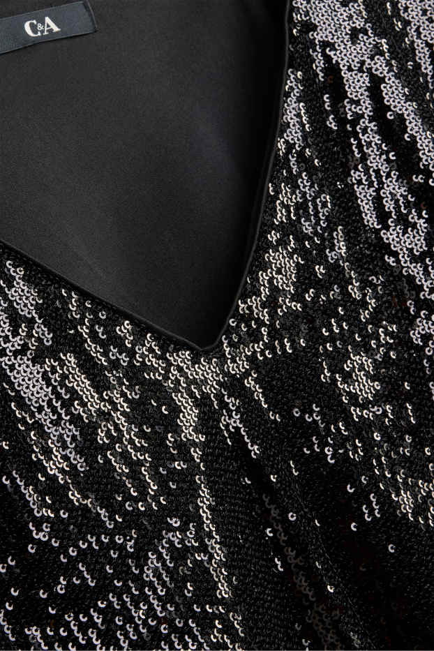 Dames - Blouse met pailletten en V-hals - zwart / zilver