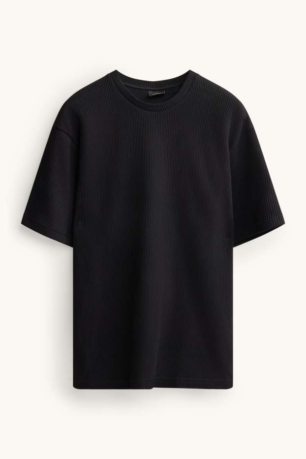 Mężczyźni - T-shirt - relaxed fit - w prążki - czarny