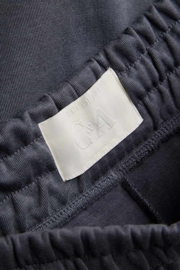 Uomo - Pantaloni sportivi - grigio