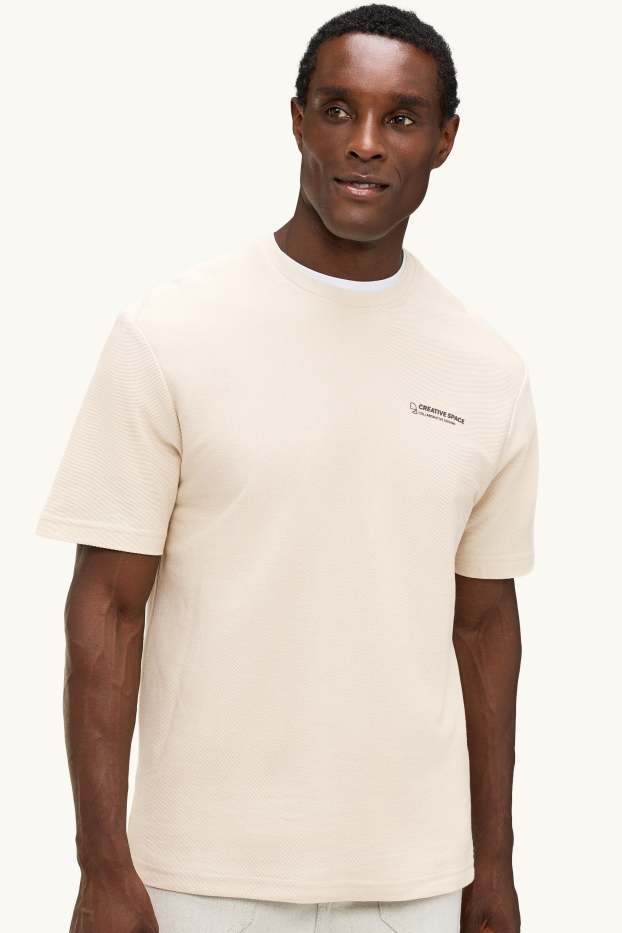 Heren - T-shirt - relaxed fit - crèmekleurig