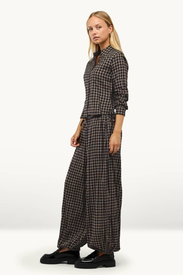 Dona - Pantalons orientals - mid waist - barrel leg - de quadres - negre/beix