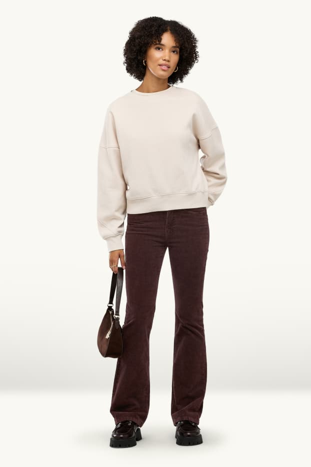 Dona - Pantalons de pana - mid waist - acampanats - marró fosc