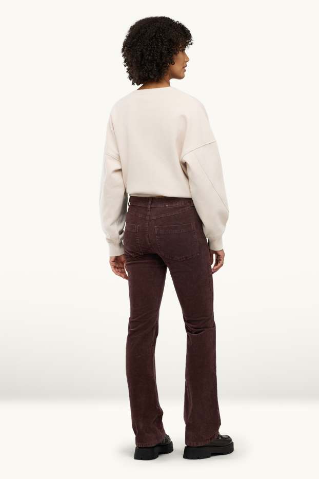 Dona - Pantalons de pana - mid waist - acampanats - marró fosc