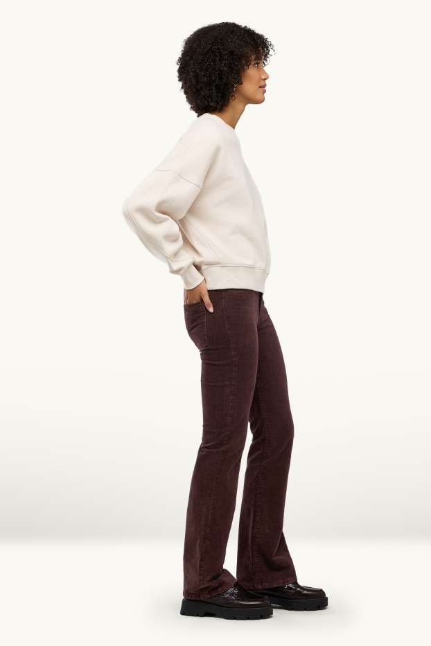 Dona - Pantalons de pana - mid waist - acampanats - marró fosc