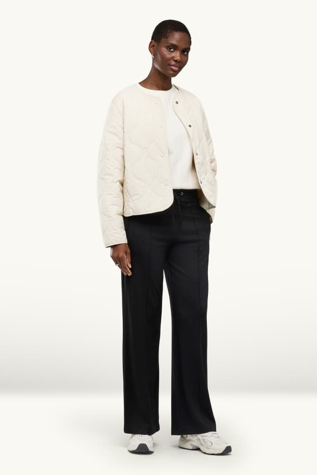 Dona - Pantalons de punt - mid waist - wide leg - negre
