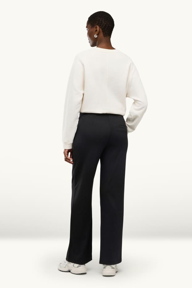 Dona - Pantalons de punt - mid waist - wide leg - negre