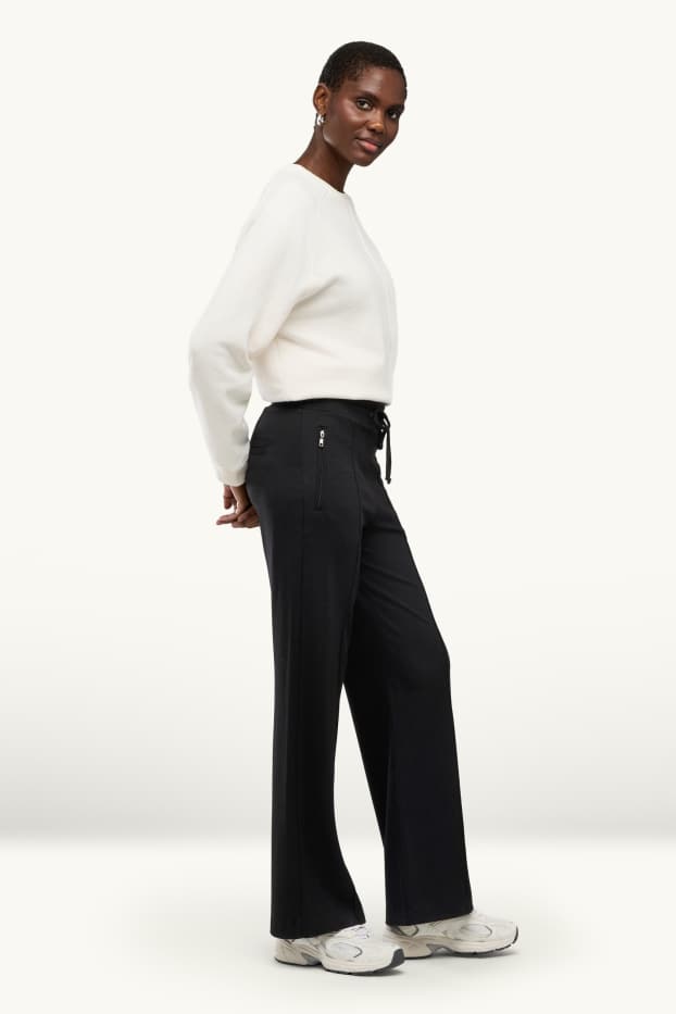 Dona - Pantalons de punt - mid waist - wide leg - negre