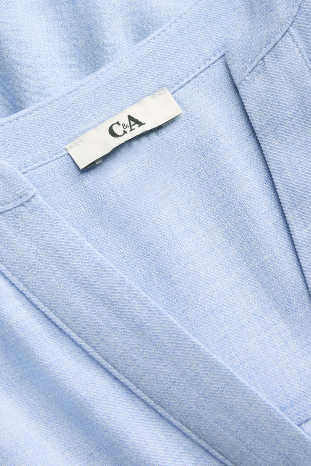 Dona - Brusa amb el coll en punta - blau clar