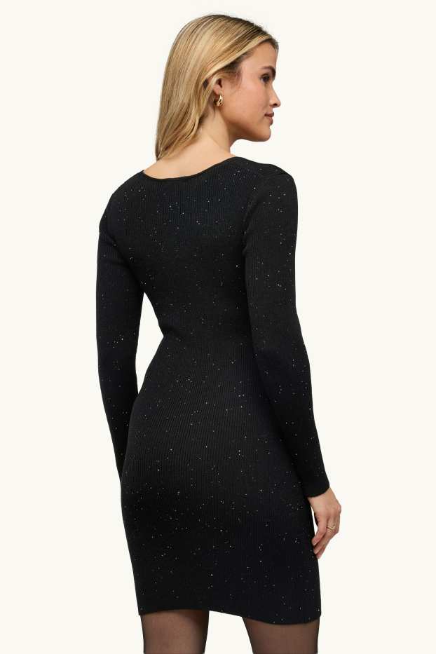 Dames - Wikkeljurk - geribd - glanseffect - zwart