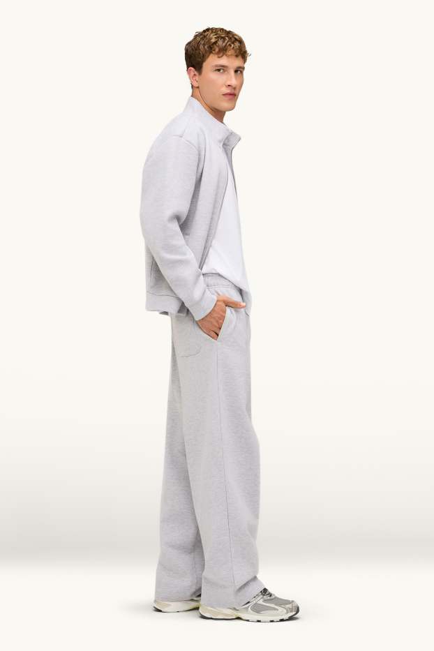 Pánské - Teplákové kalhoty - relaxed fit - světle šedá-žíhaná