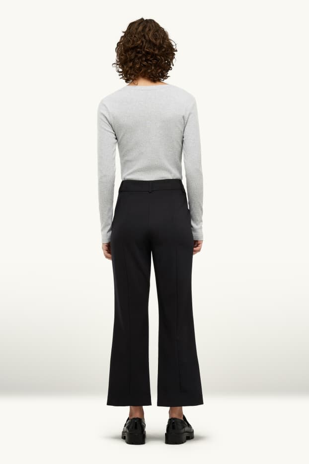 Femei - Pantaloni de stofă - talie medie - evazați - negru
