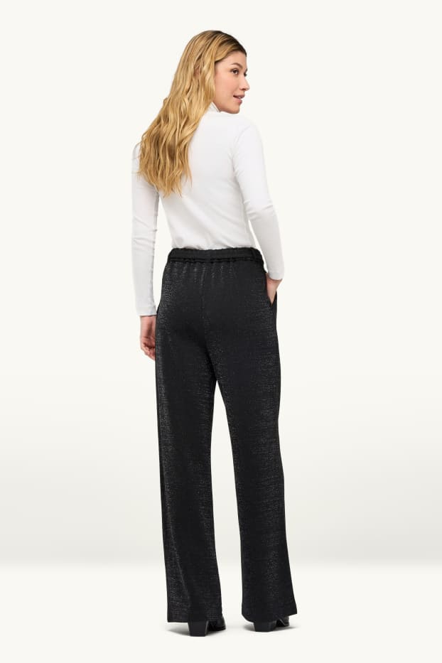 Women - Cloth trousers with belt - high waist - wide leg - shiny - black