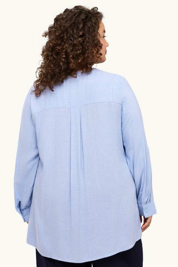 Dona - Brusa amb el coll en punta - blau clar