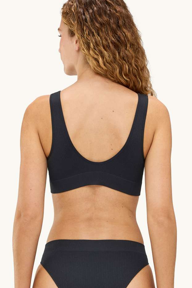 Femmes - Brassière - ampliforme - finition côtelée - seamless - noir