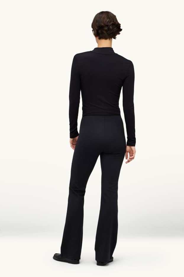 Femei - Pantaloni de stofă cu ștrasuri - talie medie - evazați - negru