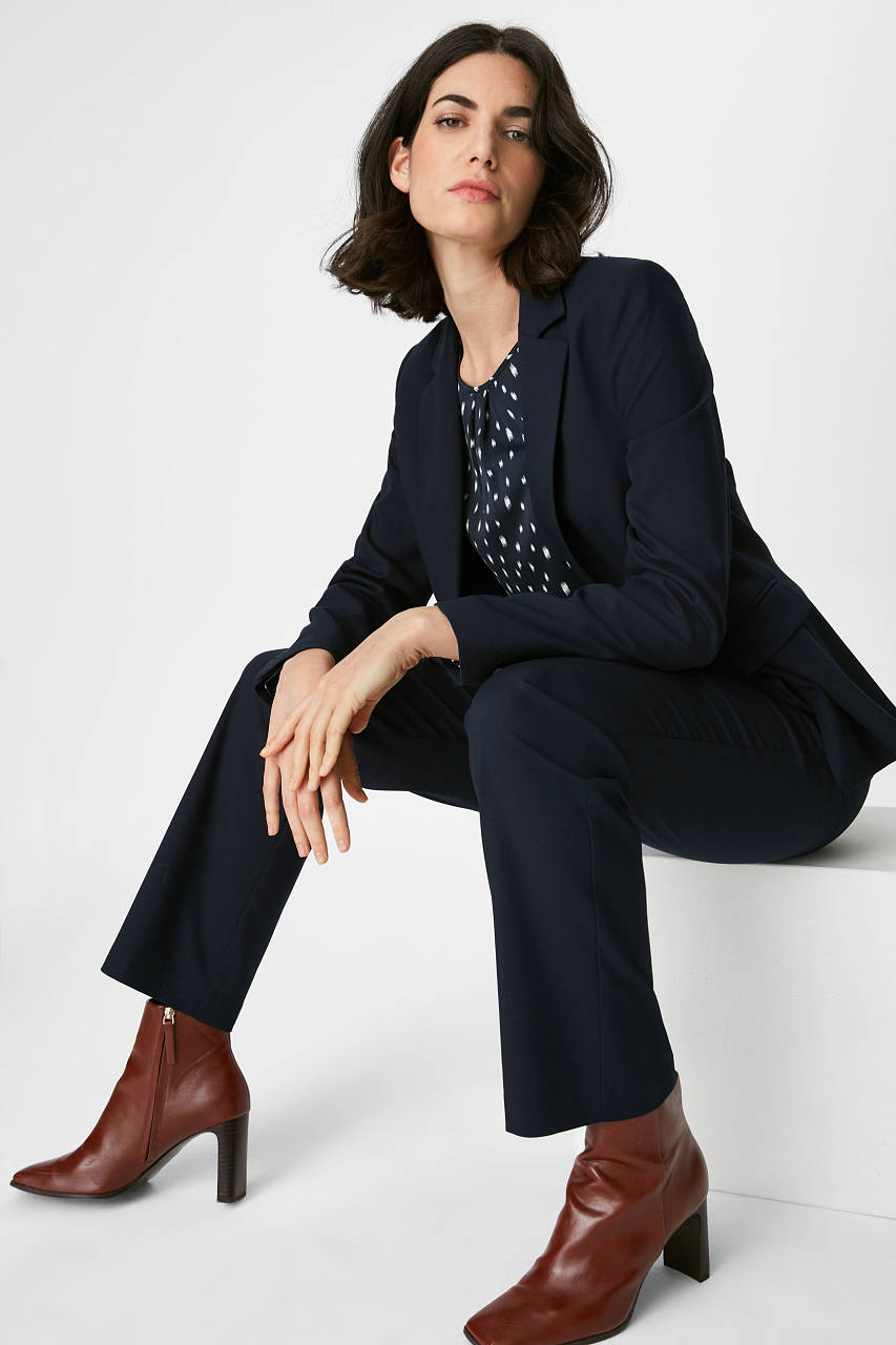 Cognac sleek boots with navy power suit