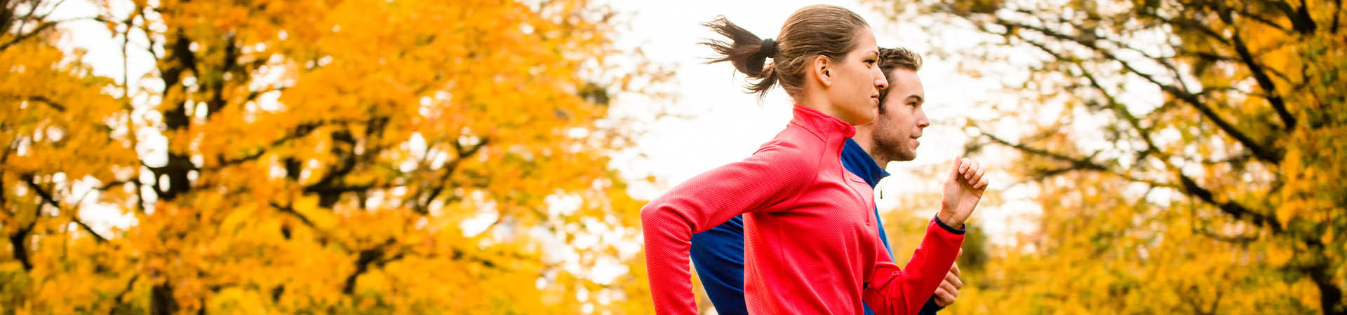 Jogging is healthy – a couple running in the park.