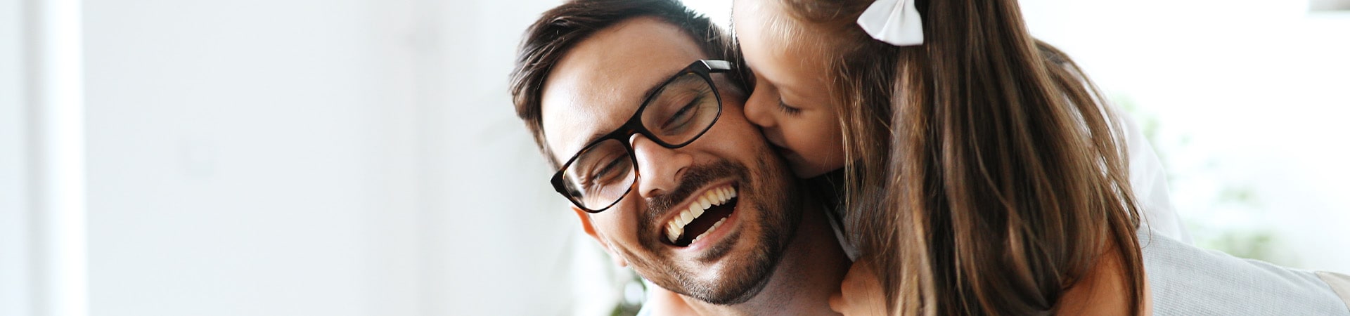 Daughter hugs dad and congratulates him on Father's Day.