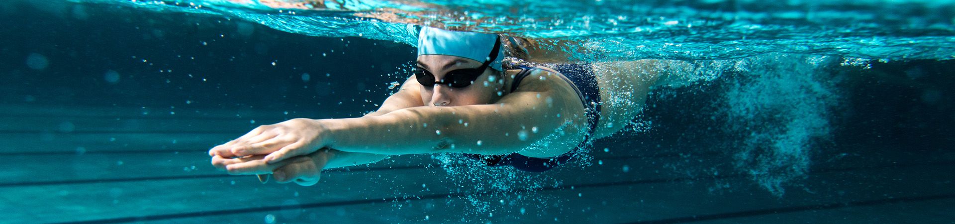 Swimming - Swimmer dives into the water.