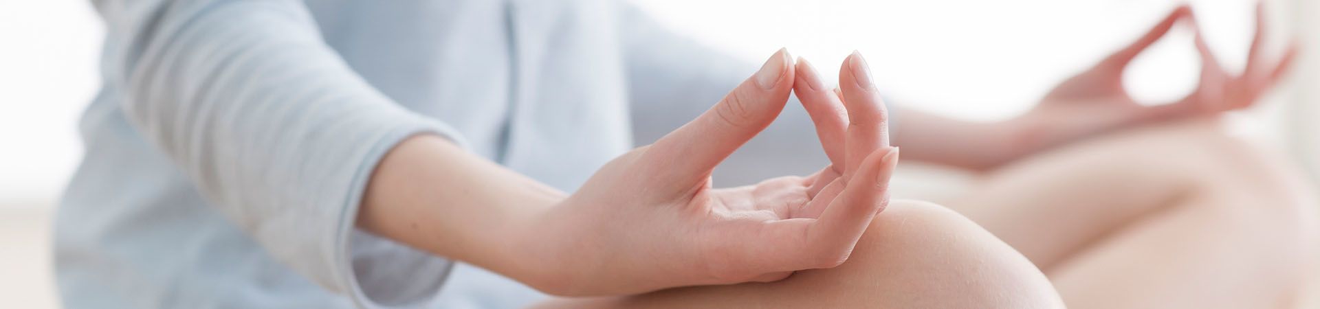 Yoga relaxation – woman meditating in yoga position.