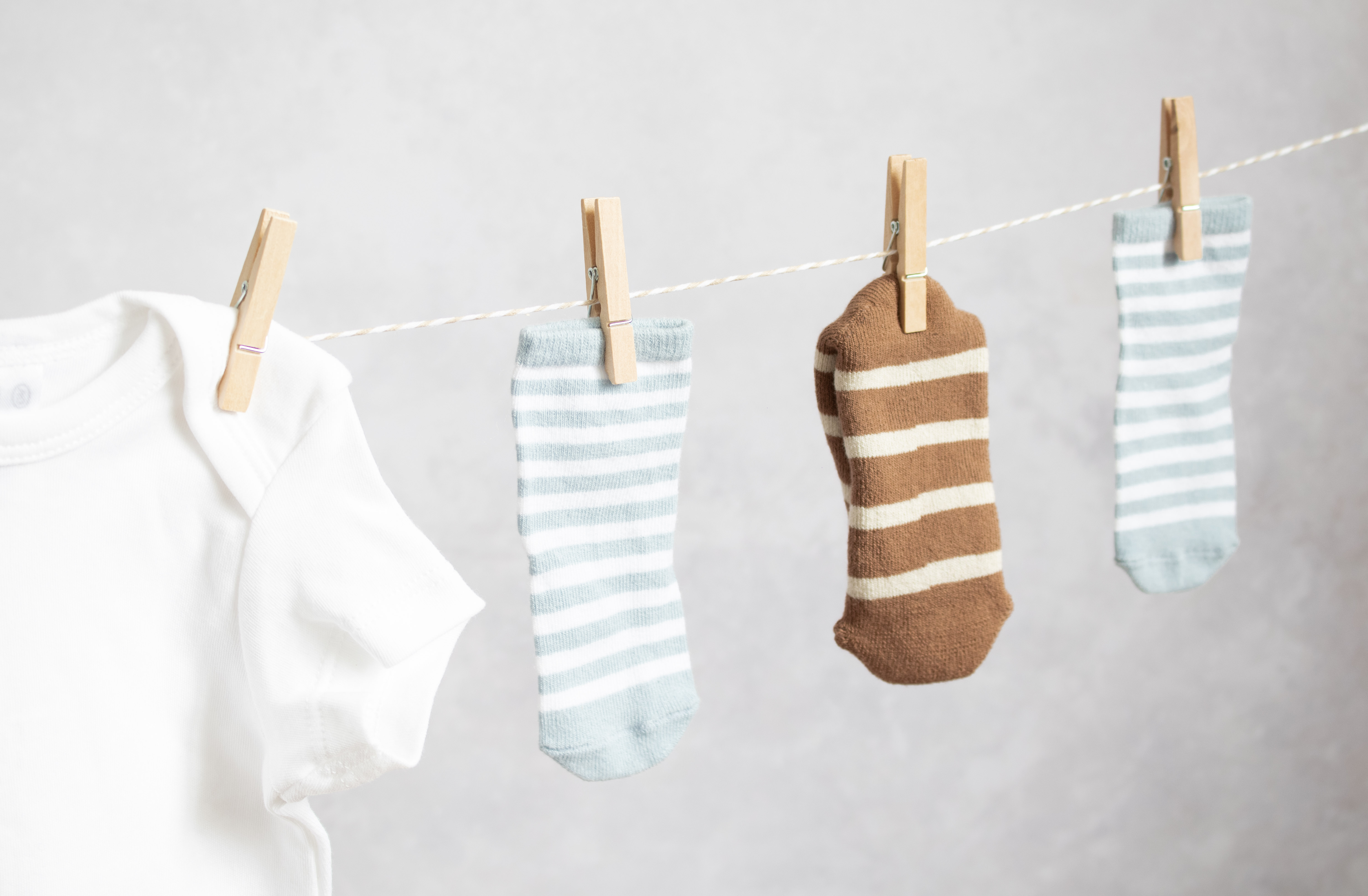 Decorative baby shower garland made of baby clothes. Decorative baby shower garland made of baby clothes.