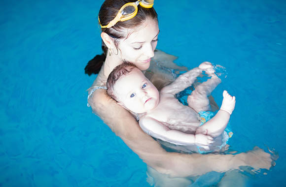 Mother with baby at baby swimming. Mother with baby at baby swimming.