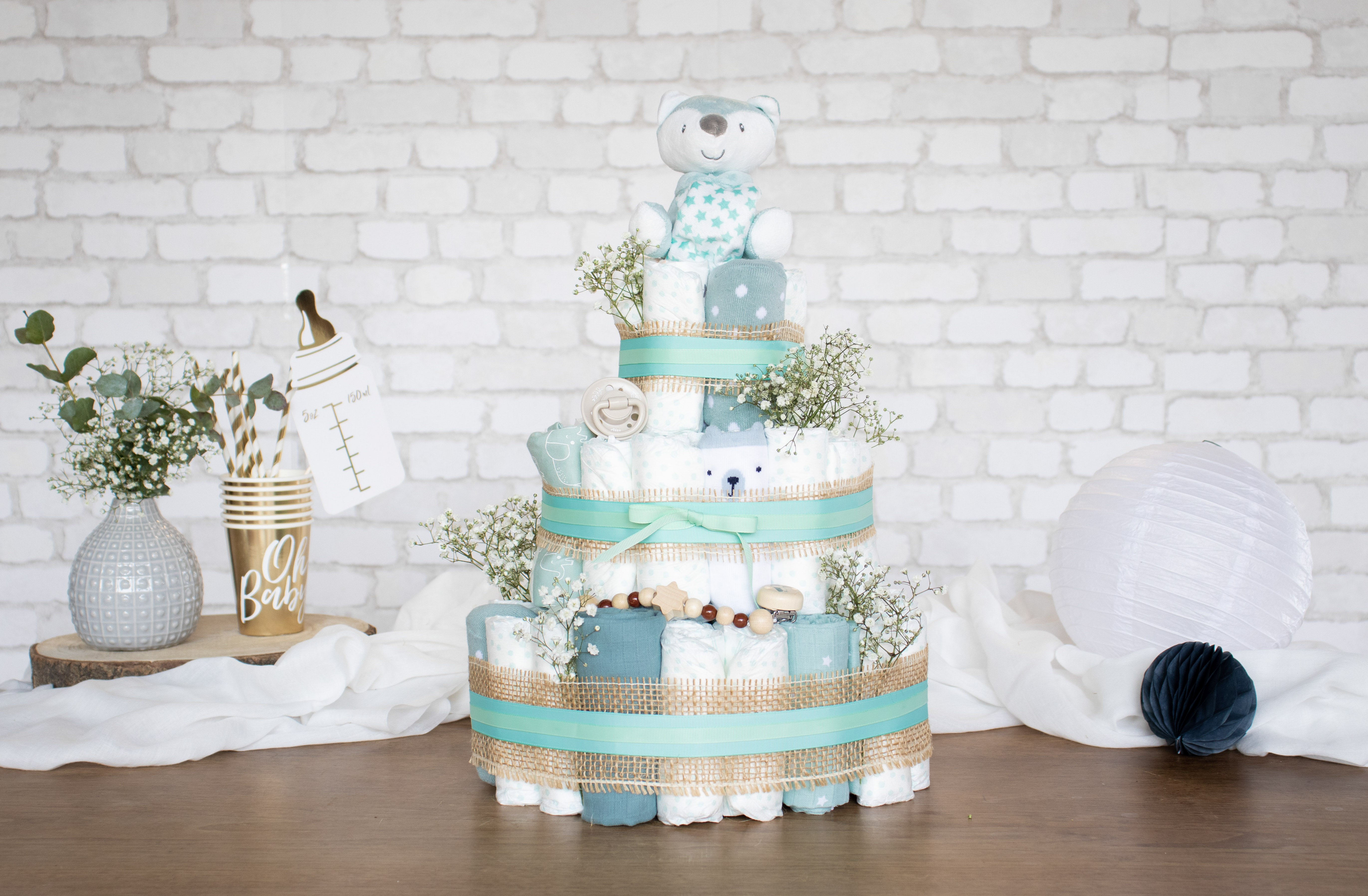 Nappy gifts along with useful care products for a baby shower. Nappy gifts along with useful care products for a baby shower.