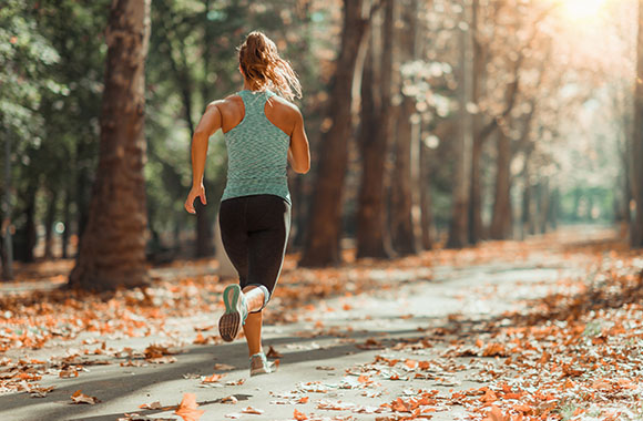 Jogger training her endurance for a hike. Jogger training her endurance for a hike.