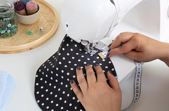 Sewing a loop in the turned DIY bowl cover.