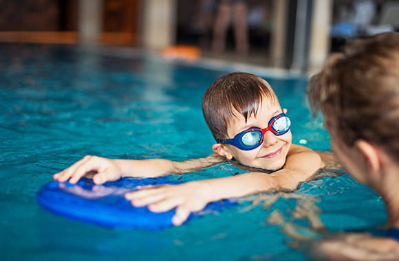 Boy in the swimming pool.