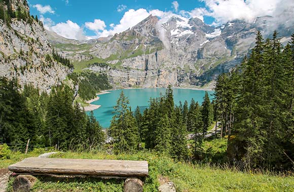 Via Alpina – view of Lake Oeschinen in the Swiss Alps. Via Alpina – view of Lake Oeschinen in the Swiss Alps.