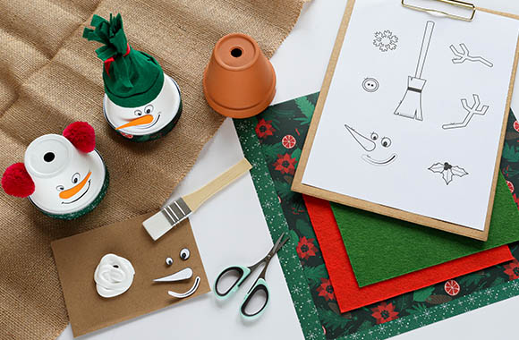 DIY craft idea for kids: snowmen and snowman faces made from ceramic pots.