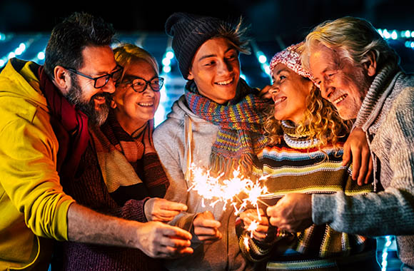 Planning a New Year’s Eve party: Family celebrates New Year’s Eve together.