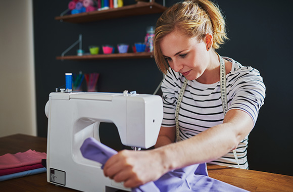 Sewing for beginners: A hobby sewer works with her sewing machine.