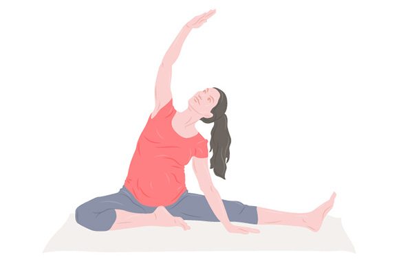 Pregnancy yoga – pregnant woman performs a side stretch.