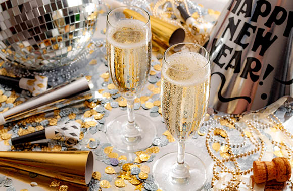 Classic New Year’s Eve table decoration in gold and silver. Classic New Year’s Eve table decoration in gold and silver.