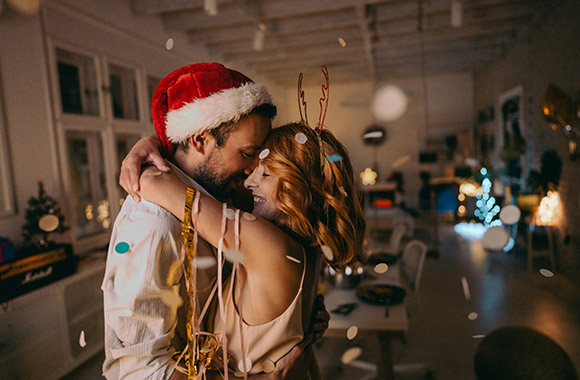 New Year’s Eve for two: Couple dancing in a small flat. New Year’s Eve for two: Couple dancing in a small flat.