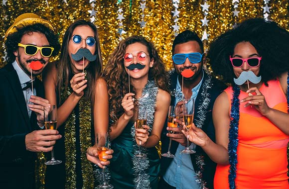 New Year’s Eve games: Group dresses up and takes a photo together.