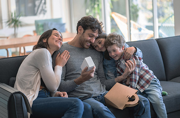 Father's Day gift Idea – a family gives presents to dad. Father's Day gift Idea – a family gives presents to dad.