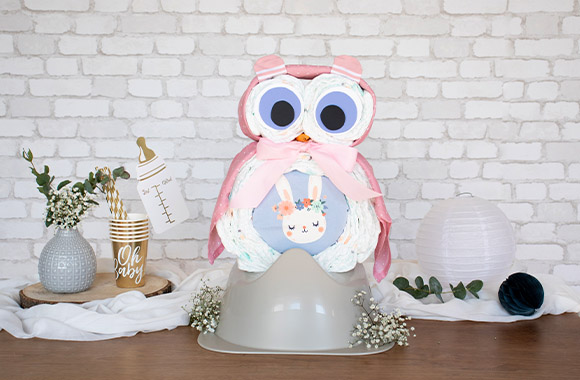 Owl diaper cake in pink and purple.