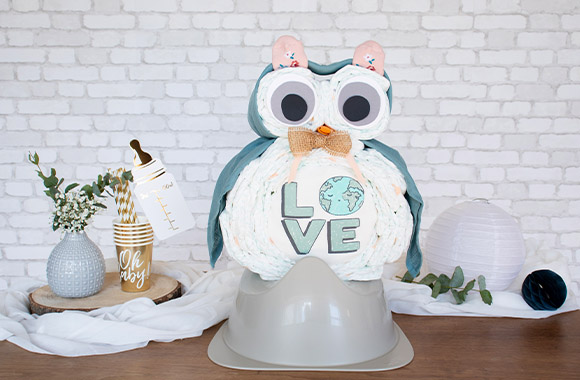 Neutral owl homemade diaper cake in neutral shades.