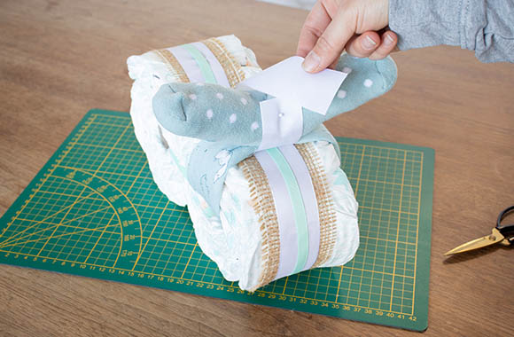 Make your own nappy cake - blend handlebars with decorative tape.