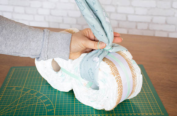 Homemade nappy cake craft - handlebars made from flannel cloth.