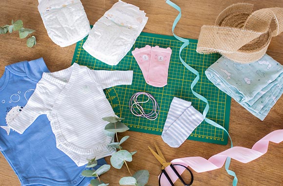 Materials needed to make a diaper cake. Materials needed to make a diaper cake.