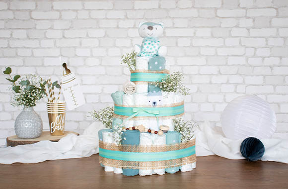 A nappy cake with neutral decorations. A nappy cake with neutral decorations.
