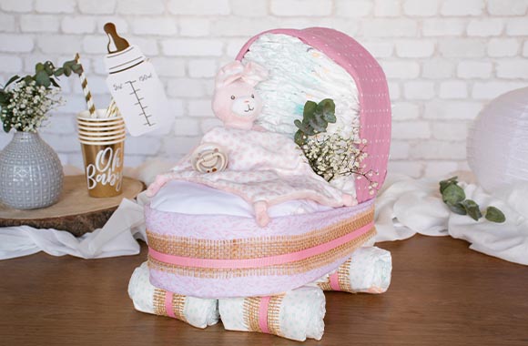 DIY pram nappy cake for newborn girls.